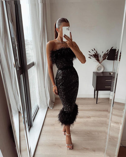 black sequin and feather dress
